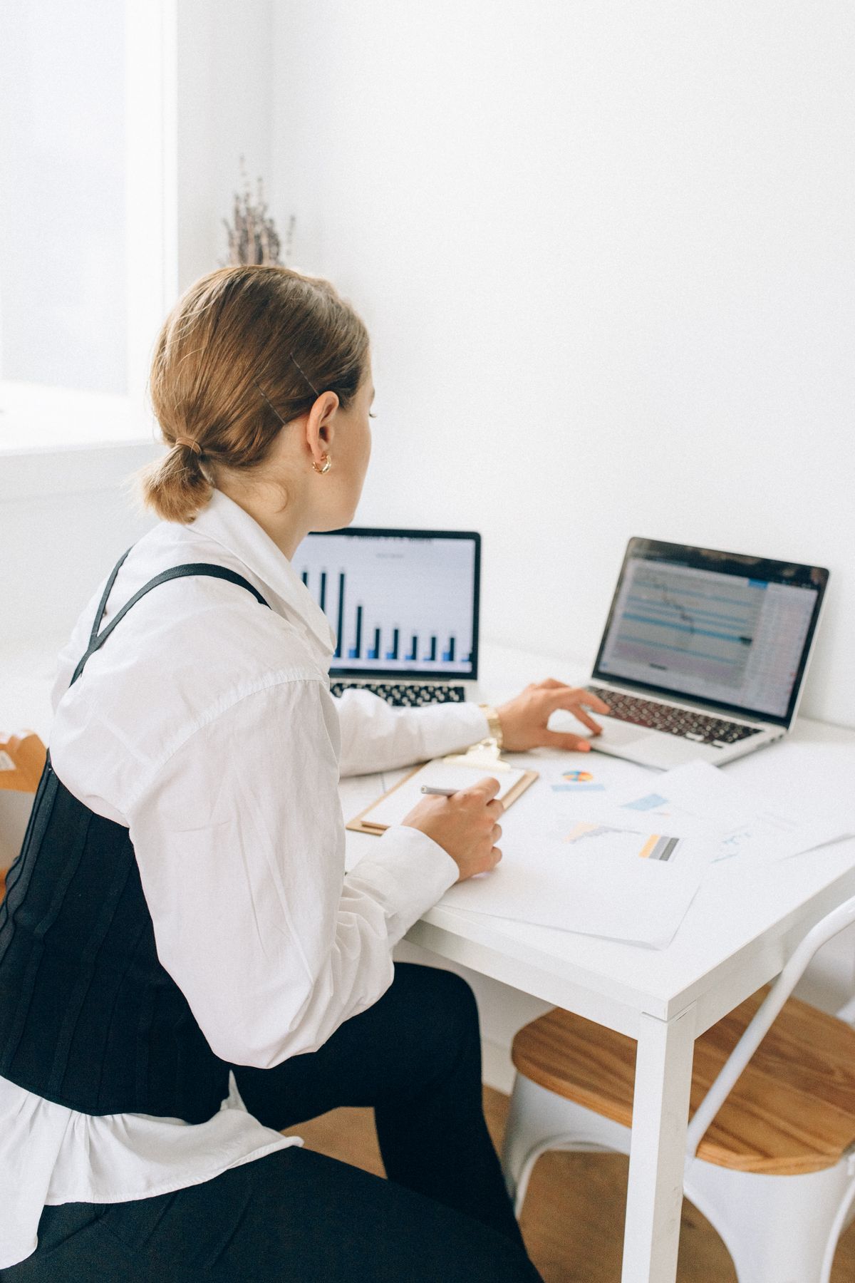 A consultant reviewing work at a desk